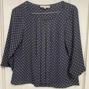 Navy and white polka-dot blouse